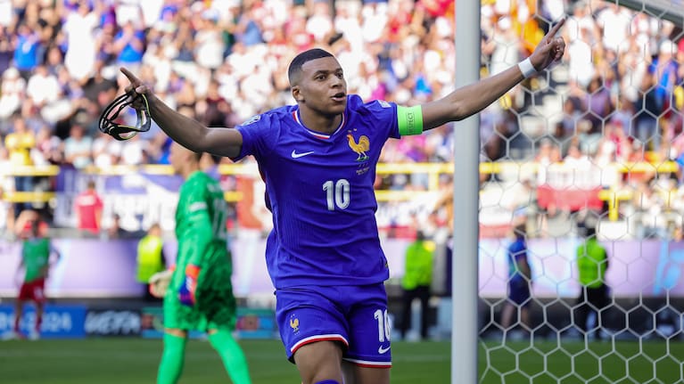 Kylian Mbappe of France celebrates after scoring from the penalty spot during the UEFA EURO 2024 group stage match between France and Poland.