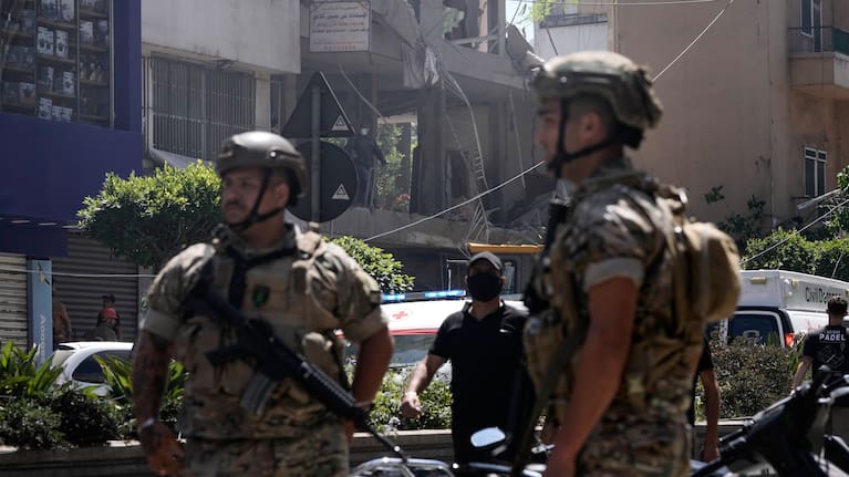 Lebanese soldiers stand guard at the site of an Israeli airstrike that struck an apartment in Dahiyeh, Beirut's southern suburbs, Lebanon.