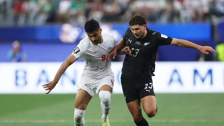 Liberato Cacace challenges for the ball during the All Whites World Cup clash with Iran. 