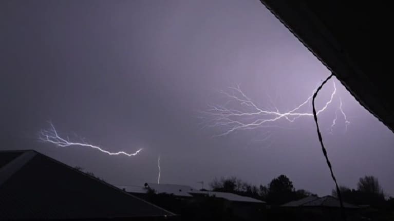 Lightning is seen streaking across the sky over Nelson.