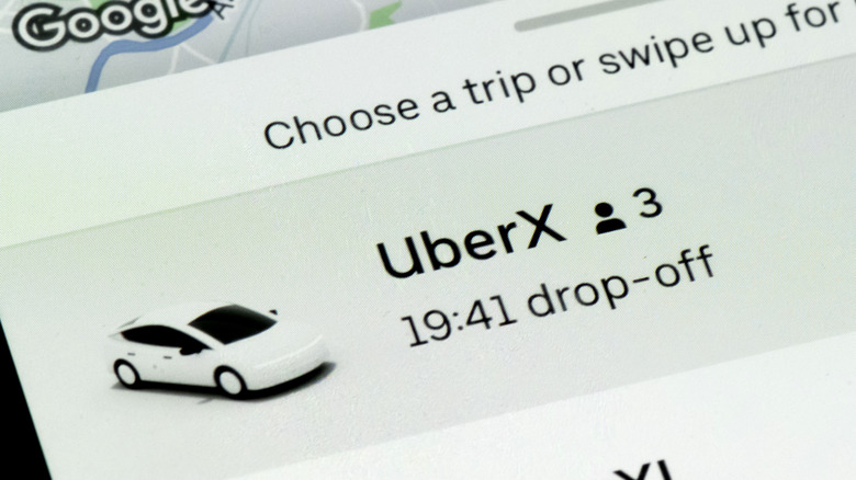 Selecting a trip rate on the Uber mobile app.