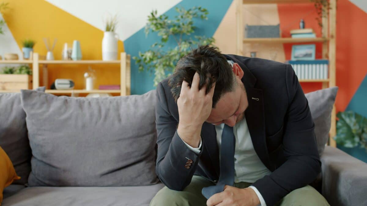 man stressed money