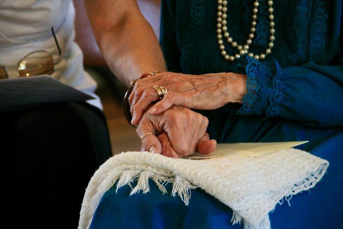 Hands holding each other dementia care expert support