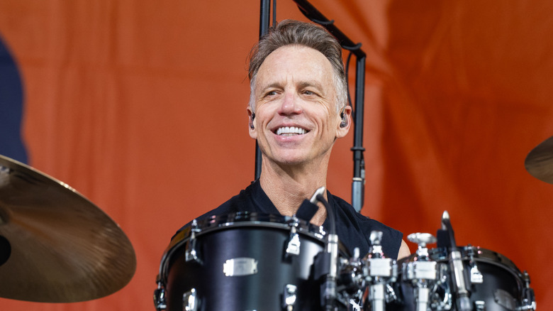 Matt Cameron smiling at drums