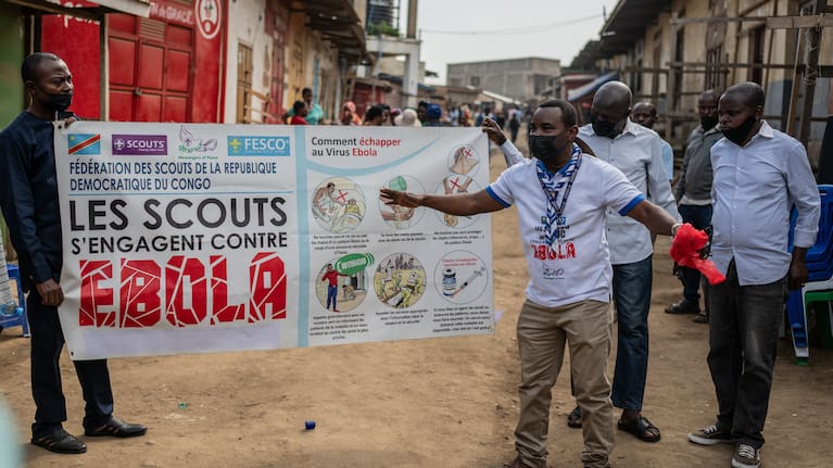 Members of the Congo Scouts movement carry an Ebola awareness banner along a street during a public sensitisation campaign amid the Ebola outbreak in Bunia, Congo, Saturday, May 23, 2026.