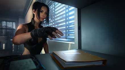 Julia Black steals a file from a safe in MindsEye.