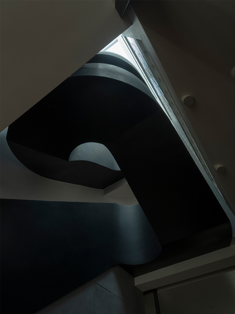 sculptural steel spiral staircase reorganizes circulation in a century-old shanghai house - 4