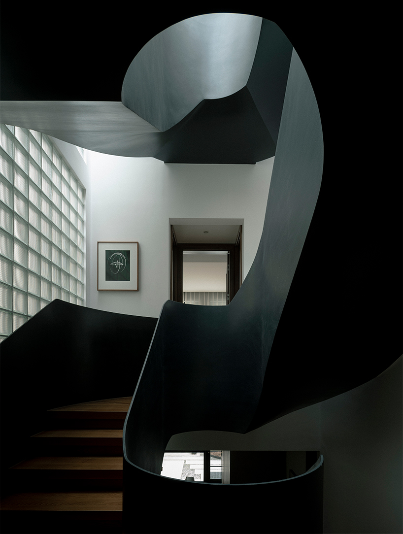 sculptural steel spiral staircase reorganizes circulation in a century-old shanghai house - 5