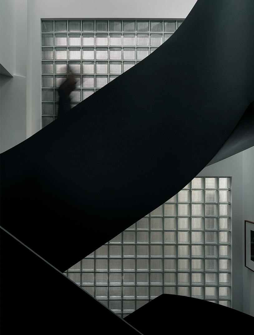 sculptural steel spiral staircase reorganizes circulation in a century-old shanghai house - 6
