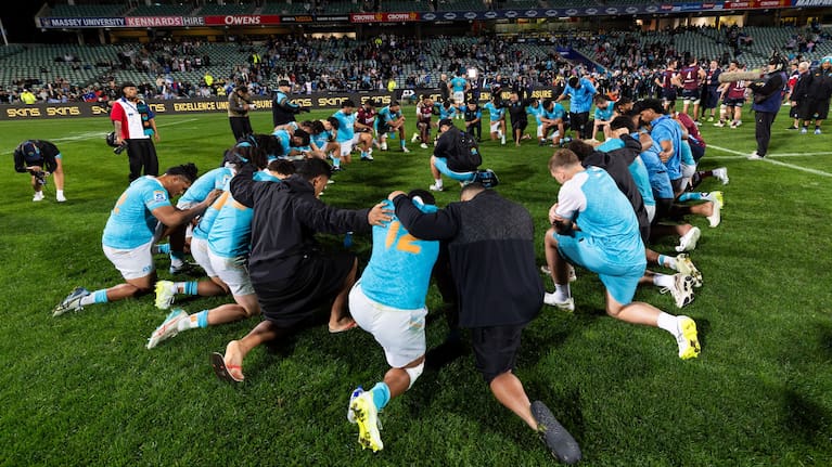 Moana Pasifika's players react to their defeat to the Reds at North Harbour Stadium.