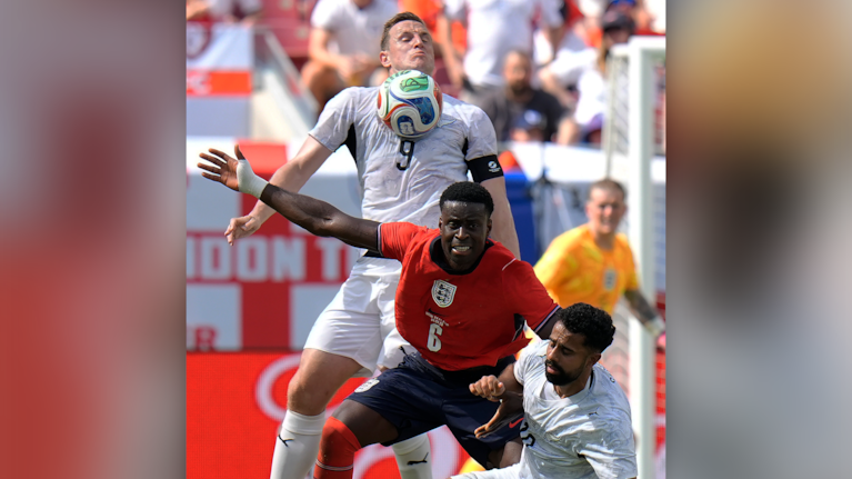 New Zealand forward Chris Wood (9) plays the ball as midfielder Sarpreet Singh (10) battles with England defender Marc Guéhi (6) during the first half of an international friendly soccer match