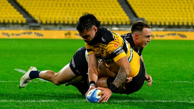 Ngane Punivai of the Hurricanes scores.