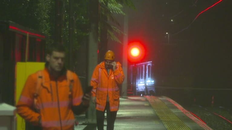 Officials at Khandallah Train Station after the derailment on Saturday night.