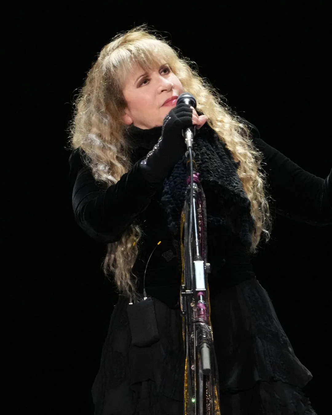 Stevie Nicks performing in an all-black outfit