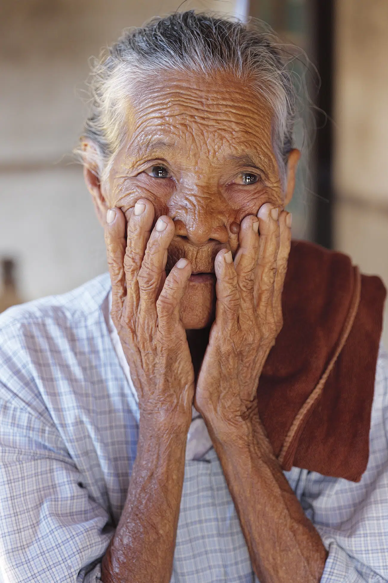 Woman holding face
