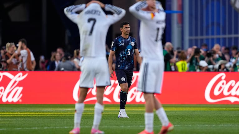 Paraguay's Fabian Balbuena (5) looks on as German players react during a penalty shootout at the end of during the World Cup round of 32 match between Germany and Paraguay in Foxborough. 