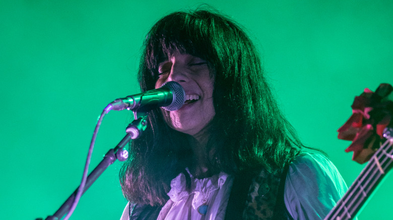 Paz Lenchantin onstage playing with Pixies