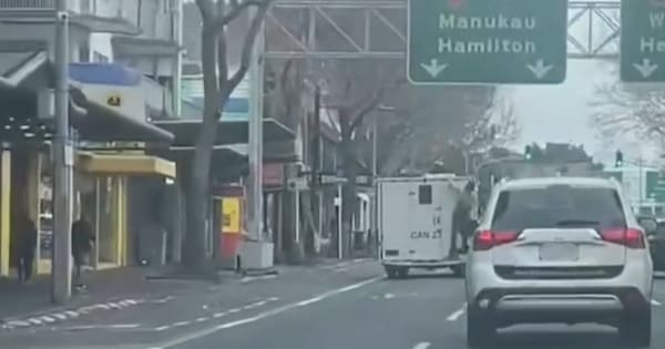 Person seen clinging to back of prison van in central Auckland