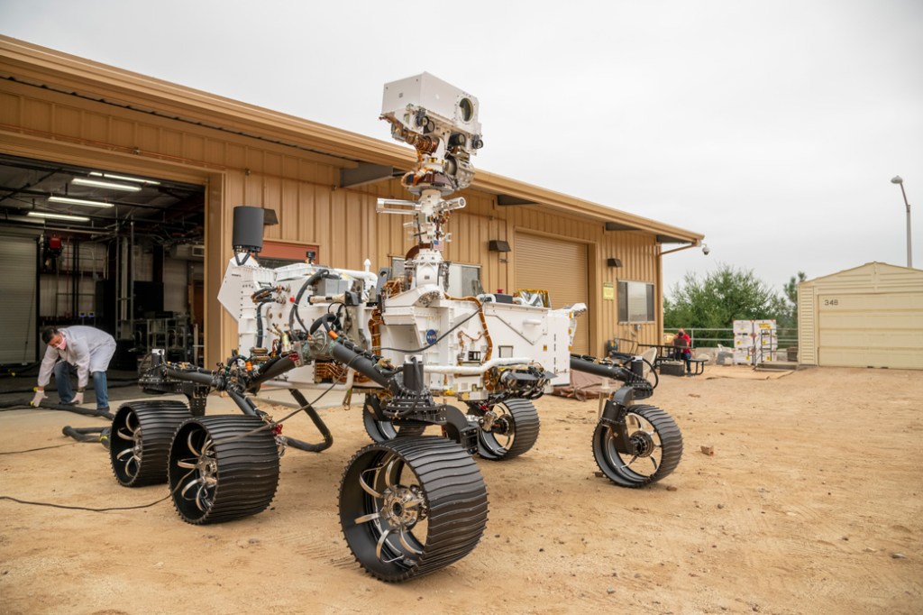 The full-scale engineering model of NASA's Perseverance rover, seen in a testing facility known as the Mars Yard.