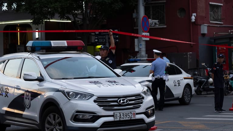 Police close off a road leading to the Citic Tower also known as Zun Tower after its facade was damaged in Beijing, Cina, Friday, June 26, 2026.