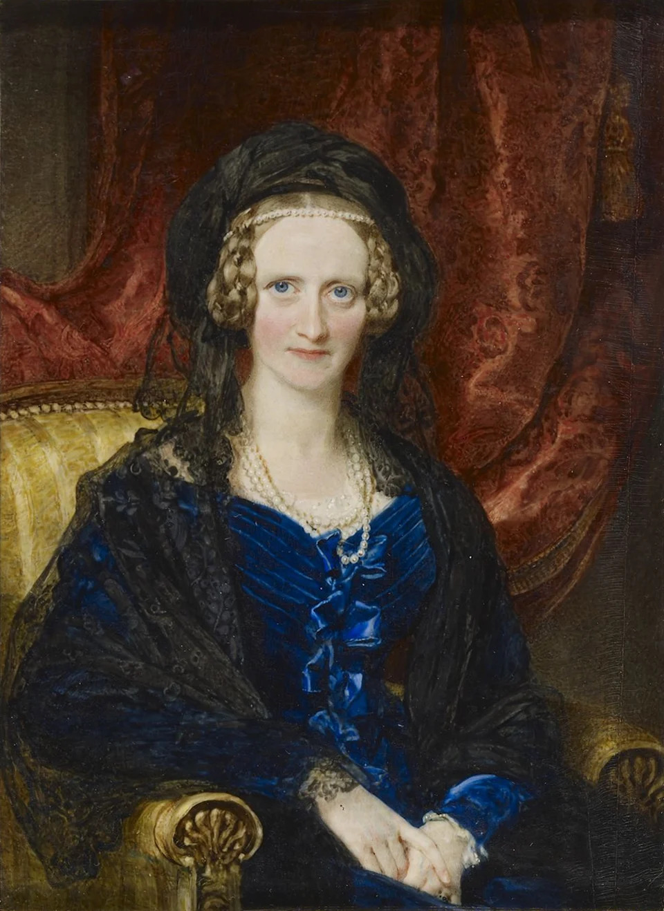 Painted portrait of Queen Adelaide, a 19th-century British queen consort, in formal dress.