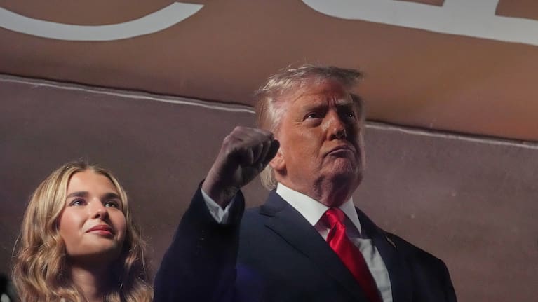 President Donald Trump gestures during the National Anthem as he attends an NBA Finals playoff basketball game between the New York Knicks and the San Antonio Spurs at Madison Square Garden in New York, Monday, June 8, 2026, with Kai Trump, left.