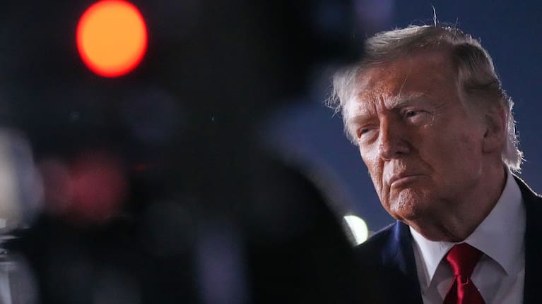 US President Donald Trump talks with reporters before boarding Air Force One at John F. Kennedy International Airport in New York.