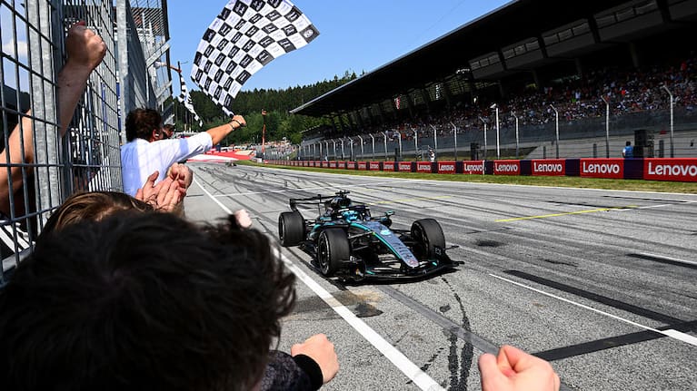 Race winner George Russell of Great Britain driving the (63) Mercedes AMG Petronas F1 Team W17 takes the chequered flag during the F1 Grand Prix of Austria