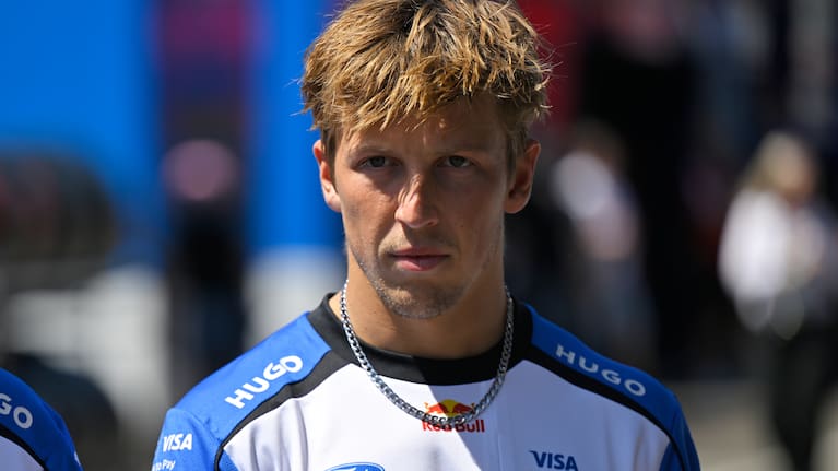 Racing Bulls driver Liam Lawson of New Zealand walks through the paddock as he arrives for the Austrian F1 Grand Prix, in Spielberg, Austria.
