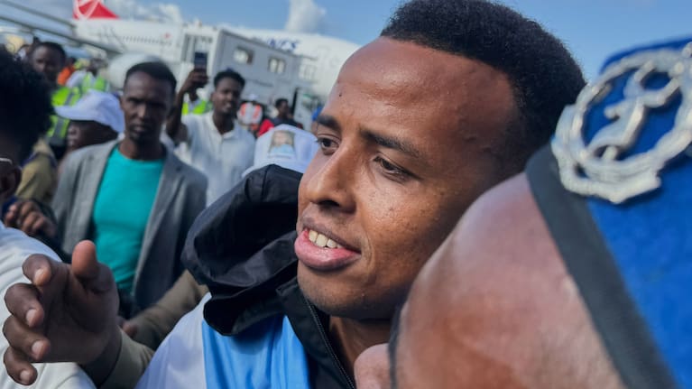 Referee Omar Artan, who was denied entry to the United States, is welcomed by supporters upon his arrival in Mogadishu