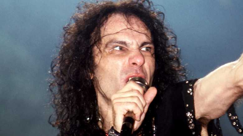 Ronnie James Dio sneering, singing, and pointing