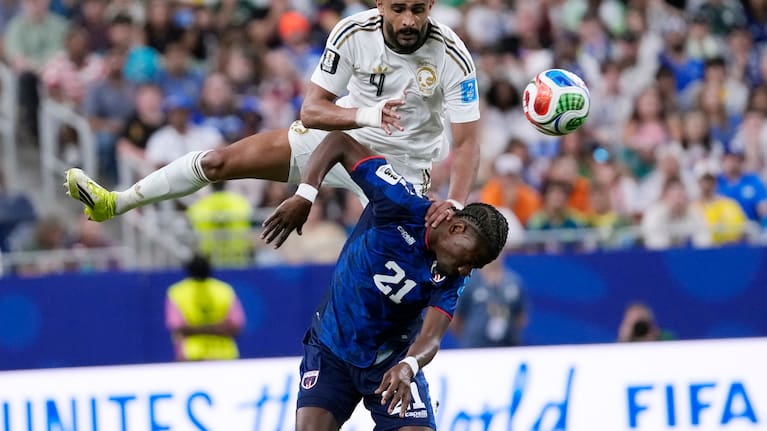Saudi Arabia's Abdulelah Alamri (4) and Cape Verde's Nuno da Costa (21) vie for the ball.