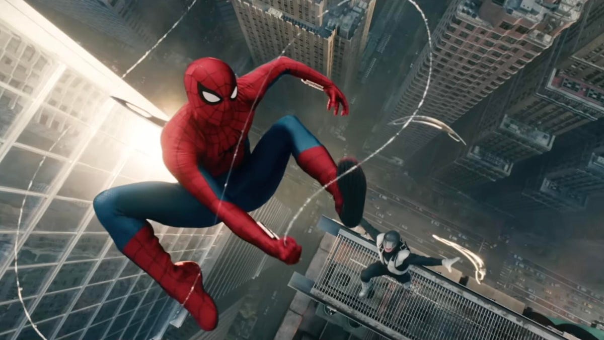 Spider-man flies through the air high above an urban canyon