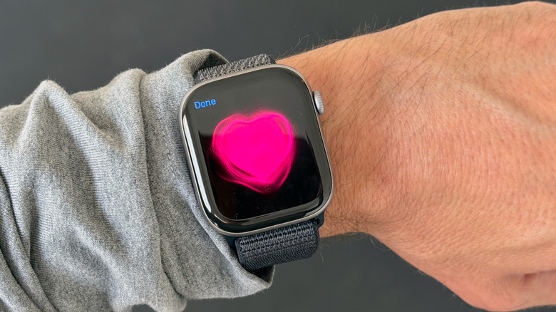 An Apple Watch with the Digital Touch heartbeat animation on its screen