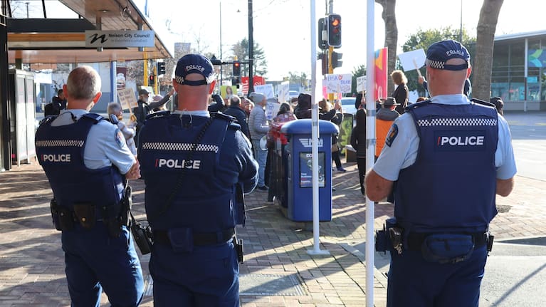 Several police officers kept an eye on the crowd while Lisa Austin gave her supporters her speech.