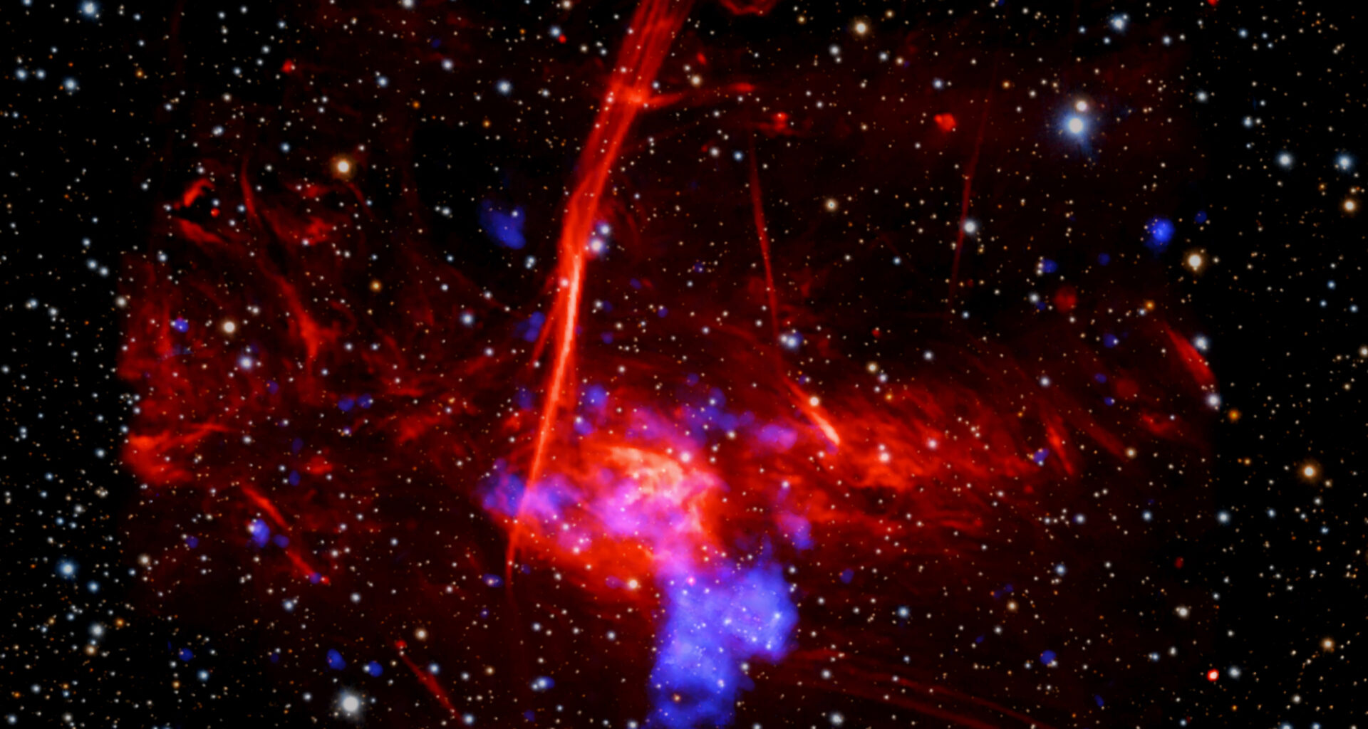 Astronomers may have uncovered a new supernova remnant in a star-forming region near the center of the Milky Way galaxy using data from Chandra and XMM-Newton. If confirmed, this would be one of the closest supernova remnants to the supermassive black hole in the Galactic Center. This image shows the region where the evidence was found, which contains X-rays from Chandra and XMM-Newton, radio data from the MeerKAT telescope in South Africa, and an optical image from the Pan-STARRS telescopes in Hawaii.