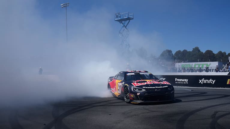 Shane van Gisbergen celebrates with a massive burnout for the grandstands.