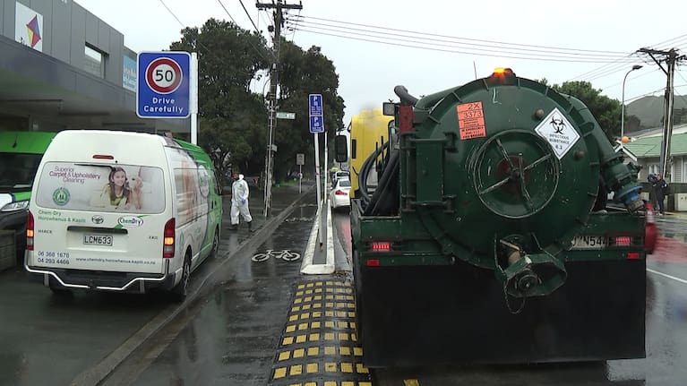 Staff work to clean a daycare closed after raw sewage flooded an Island Bay street overnight.