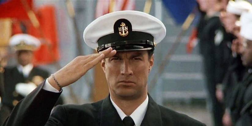 Steven Seagal wears a military dress uniform and salutes in Under Siege
