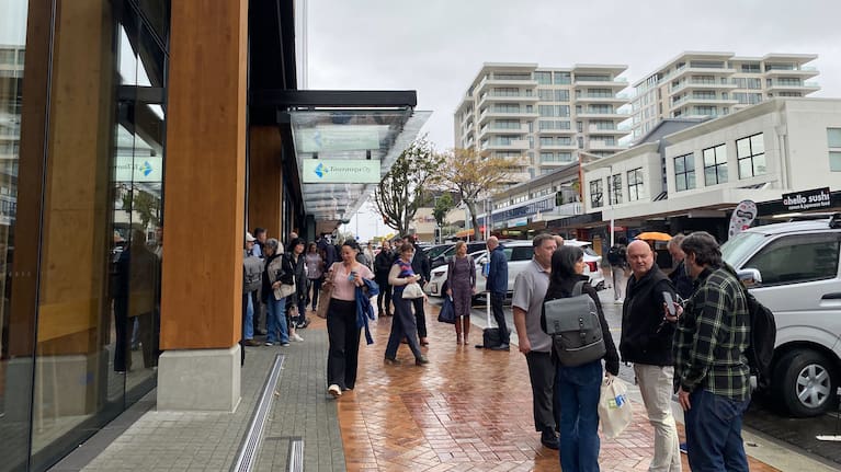 Tauranga City Council staff on Devonport Rd after the administration building was evacuated.