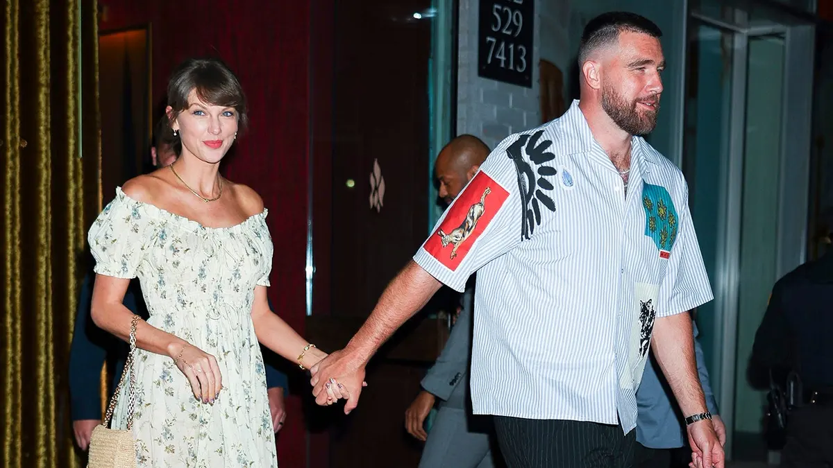 Taylor Swift and Travis Kelce standing together in New York City