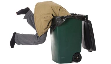 man in a trash can