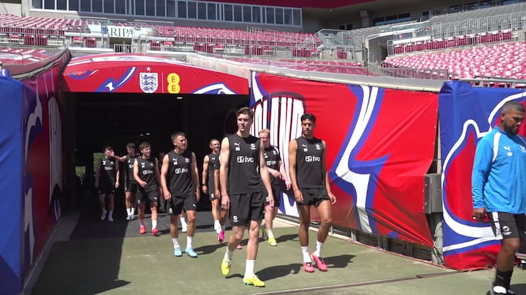 The All Whites enter Raymond James Stadium in Tampa, Florida for a training session.