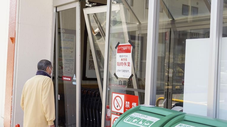 The automatic door is seen damaged due to an earthquake at a supermarket in Hachinohe, Aomori prefecture, northern Japan. (Source: Kyodo News via AP)