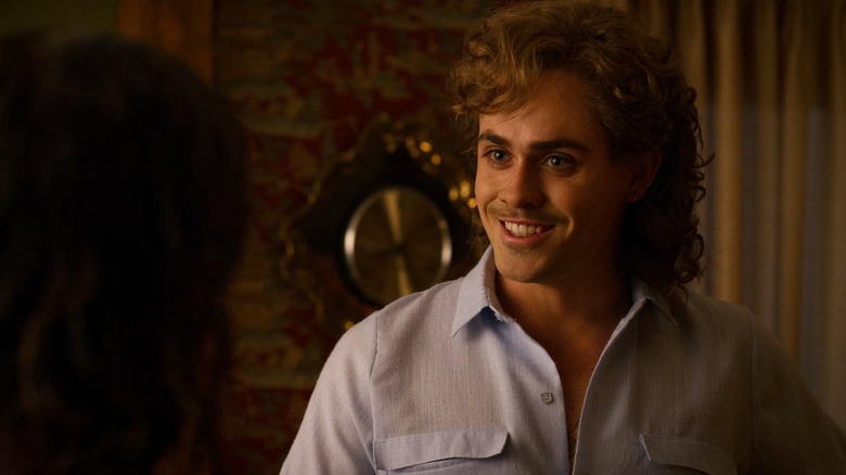 Dacre Montgomery smiling as Billy in Stranger Things
