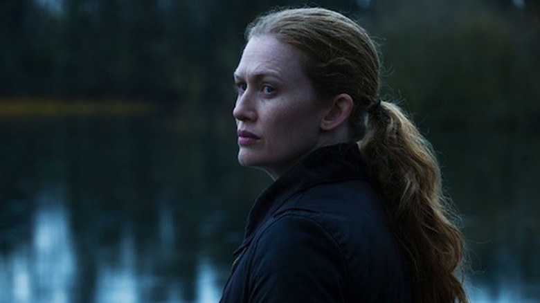 Sarah Linden (Mireille Enos) looks back from a pond) in The Killing (2011)
