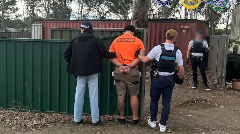 The men, aged 21 and 25, were arrested on Friday after an operation by Australian Federal Police