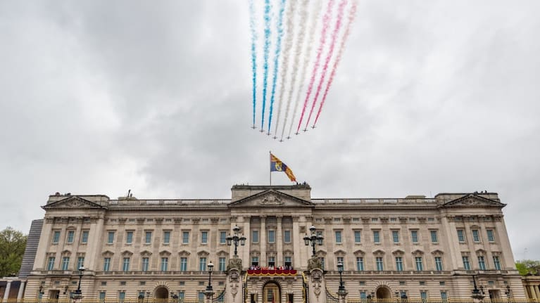 The Red Arrows fly over Buckingham Palace during the Coronation of King Charles III and Queen Camilla.