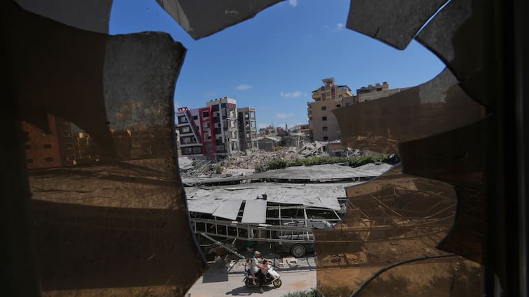 The southern town of Khiam, Lebanon, is seen through a fence near the Lebanon-Israel border, Wednesday, June 10, 2026.