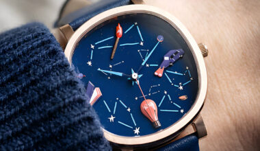 four hand-painted symbols form a wearable constellation of human progress on watch dial